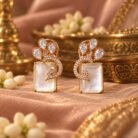 White Brooch Golden Earrings