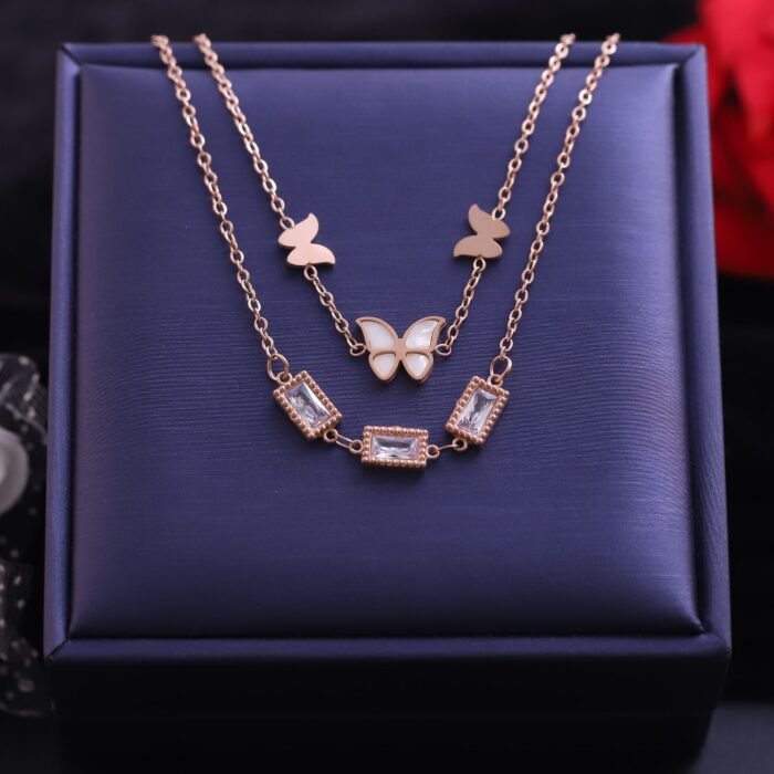 1TXMZXFMi8Pnp9LP48WgizmzF1cSipOFe.jpg 18k Rose Gold Plated Dual Layered Chain Necklace with Cream Enamel Butterfly and Rectangular Gemstone